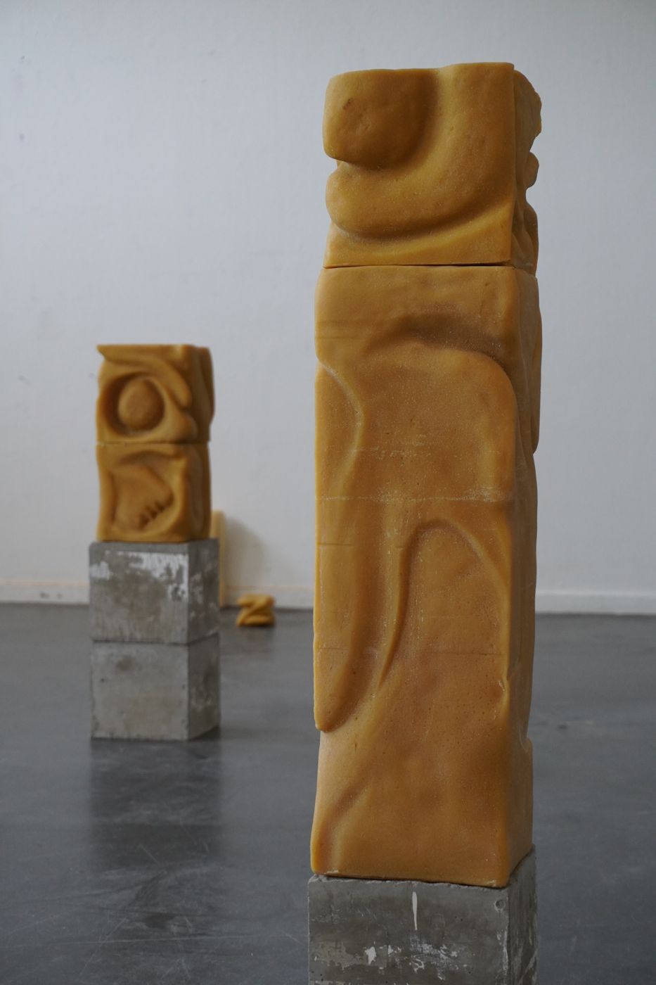What remains, beeswax sculptures on concrete bases